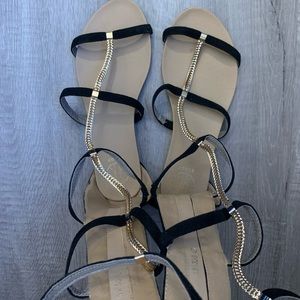 Black and gold link gladiator sandals